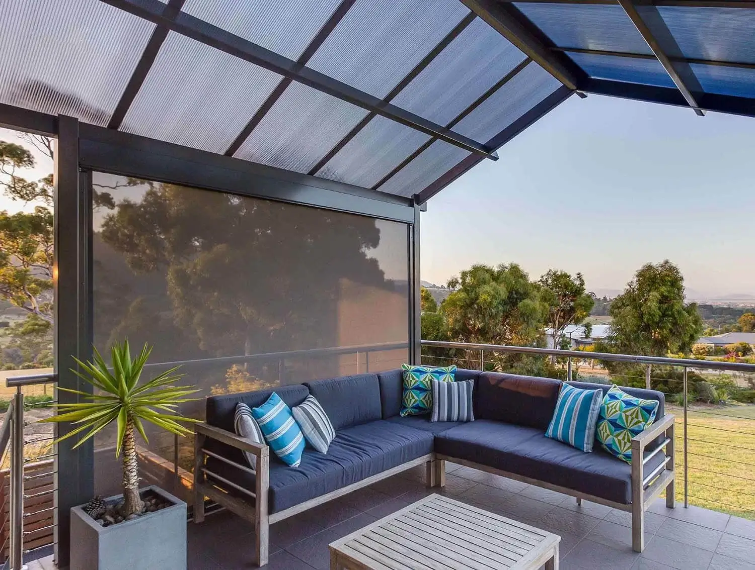 Modern patio with stylish outdoor blinds, providing shade and comfort